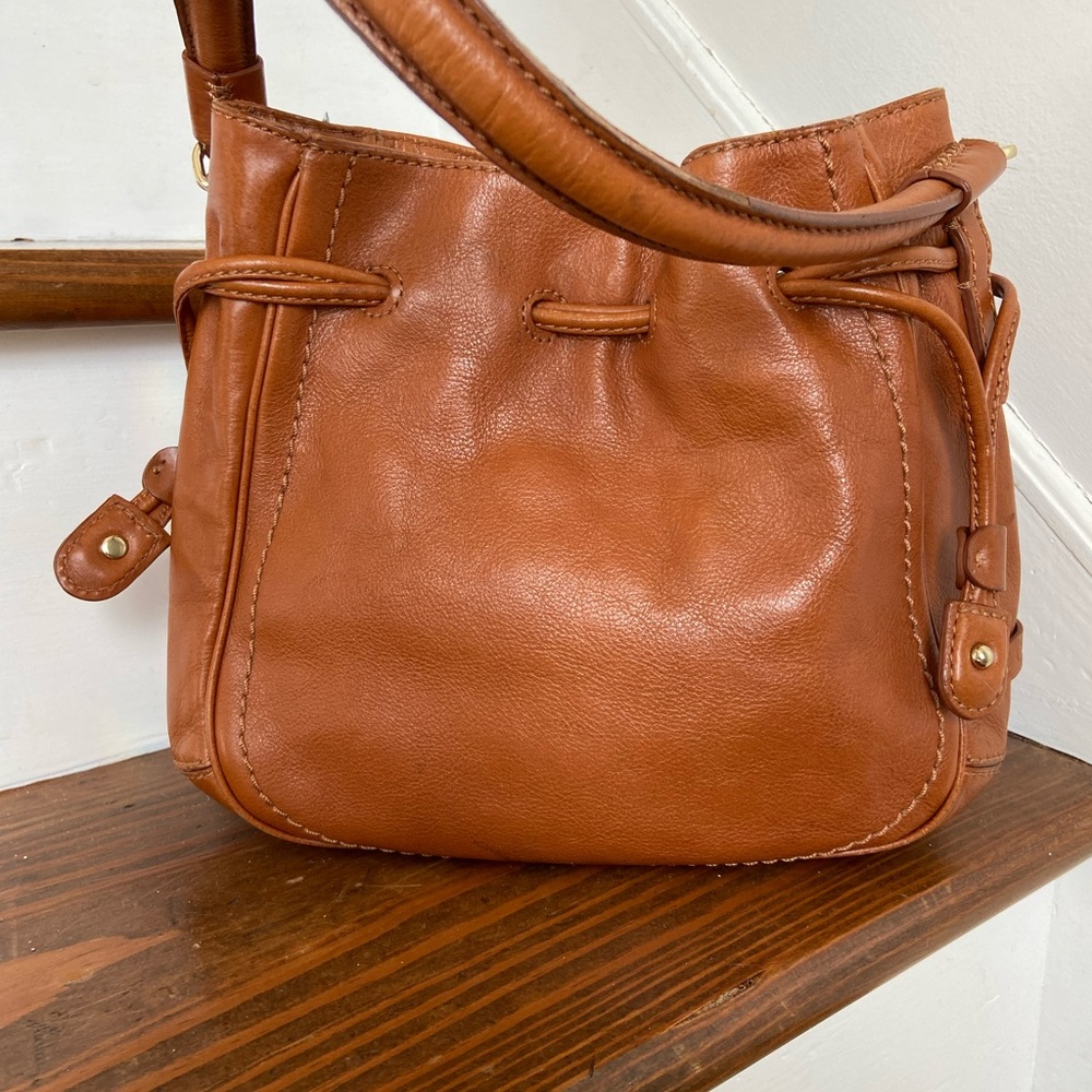 Cole Hann boho style brown leather shoulder bag with leather Draw string.